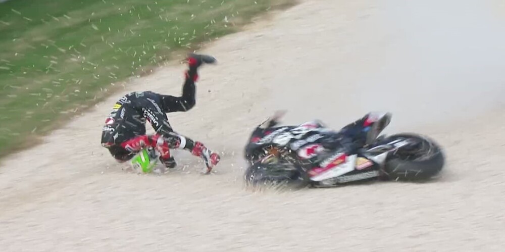 Motorcycle racer crashing